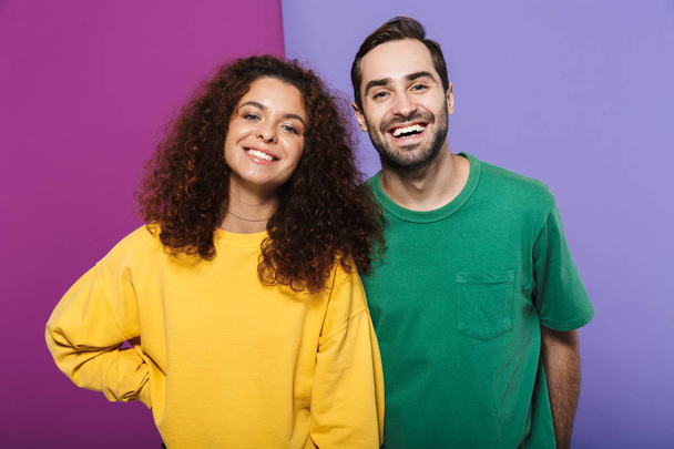 Portrait of beautiful caucasian couple man and woman in colorful - Photo, Image