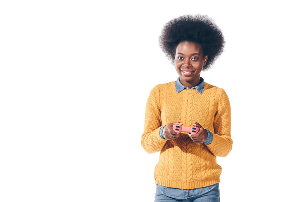 smiling african american girl playing video game with joystick, isolated on white - Foto, Imagem