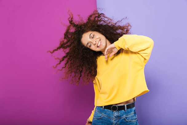 Image of pretty happy curly woman swearing casual clothes smilin - Fotó, kép