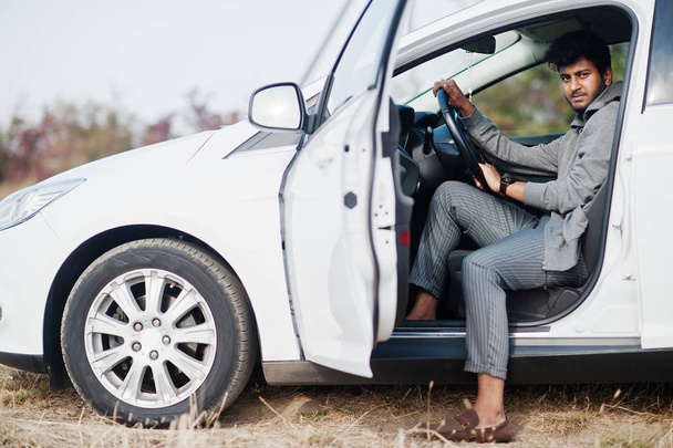 Indian man at casual wear posed at white car. - Photo, Image