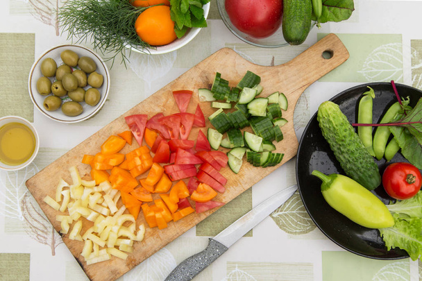 Cooking fresh mixed vegetables salad. Ingredients for cooking vegetarian, diet food - Фото, зображення