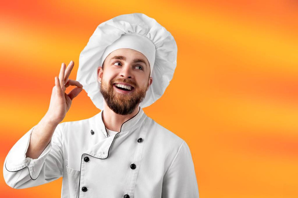 Professional chef in white hat - Foto, afbeelding