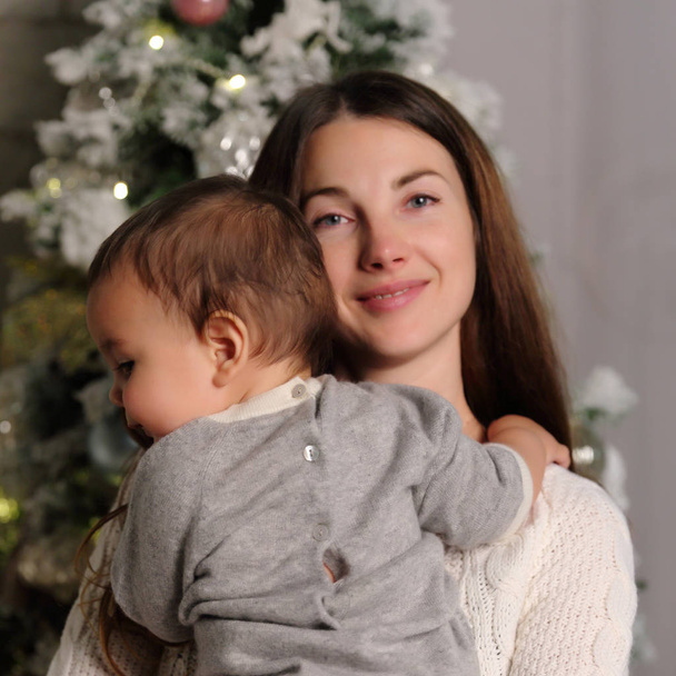 Mother and baby on Christmas holiday - Foto, afbeelding