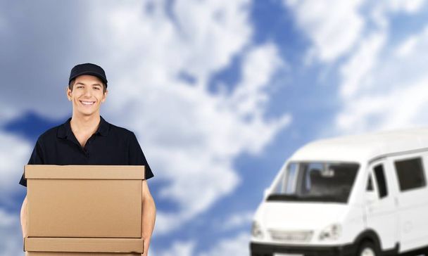 delivery worker and car on background - Photo, Image