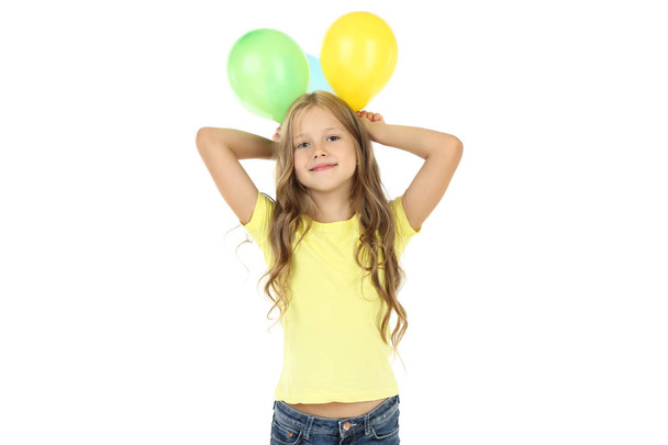 Pretty little girl with rubber balloons on white background - Foto, Imagen