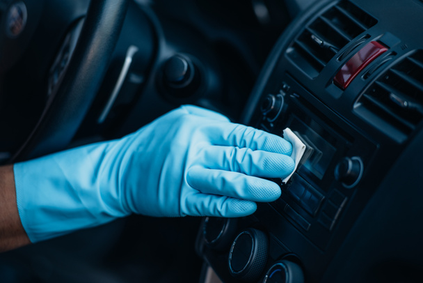 cropped view of car cleaner polishing control panel on dashboard - Fotografie, Obrázek