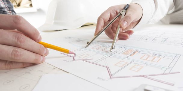 Architects working on blueprint, real estate project. Architect workplace. Construction concept. Engineering tools. - Фото, изображение