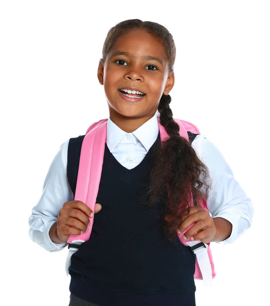 Happy African-American girl in school uniform on white background - Φωτογραφία, εικόνα
