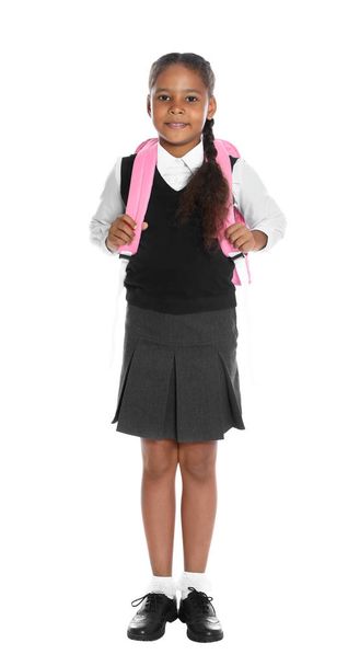 Happy African-American girl in school uniform on white background - Valokuva, kuva