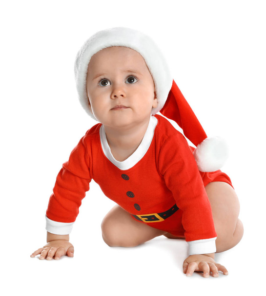 Cute little baby wearing festive Christmas costume on white background - Фото, изображение