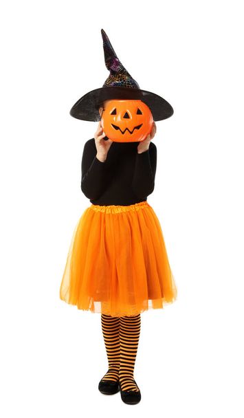 Cute little girl with pumpkin candy bucket wearing Halloween costume on white background - Fotó, kép