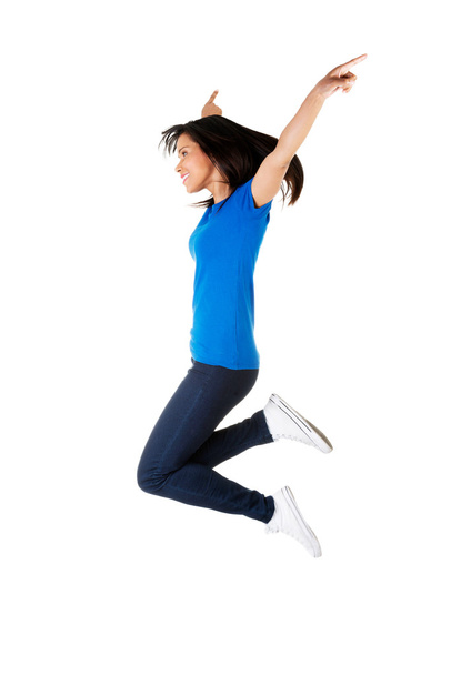 Young happy woman jumping in the air - Photo, Image