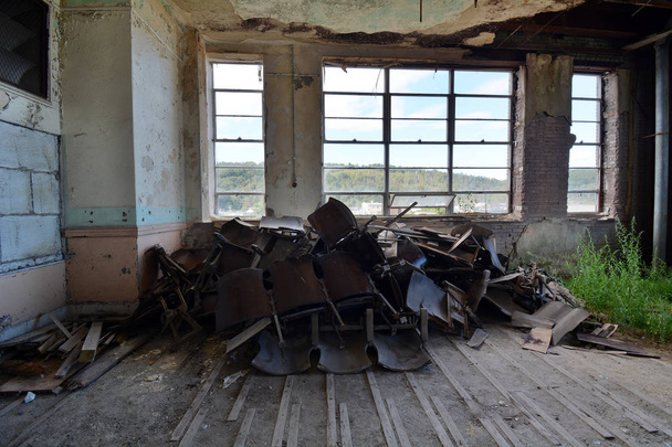 Pile of Vintage Wooden Auditorium Seats in Room of an Abandoned School - Photo, Image