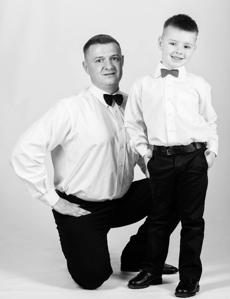 nobleman. little boy with dad businessman. family day. tuxedo style. happy child with father. business meeting party. trust and values. male fashion. father and son in formal suit. nobleman concept - Foto, afbeelding
