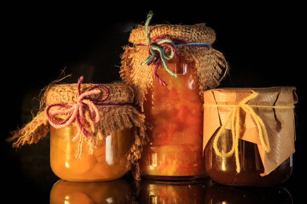closeup three glass jars of delicious jam with decoration - Foto, Imagen