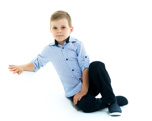 Little boy portrait in studio on white cyclorama. The concept of - 写真・画像