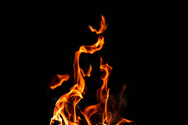 Fire, flames on a black background isolate. Concept fire grill heat weekend barbecue. - Photo, image