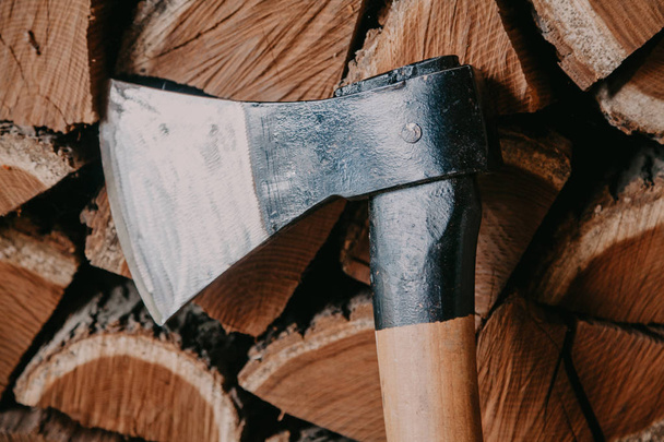 Sharp ax on background of chopped firewood - Zdjęcie, obraz