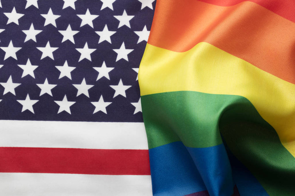 American stars and stripes flag alongside a gay Pride LGBT rainb - Φωτογραφία, εικόνα