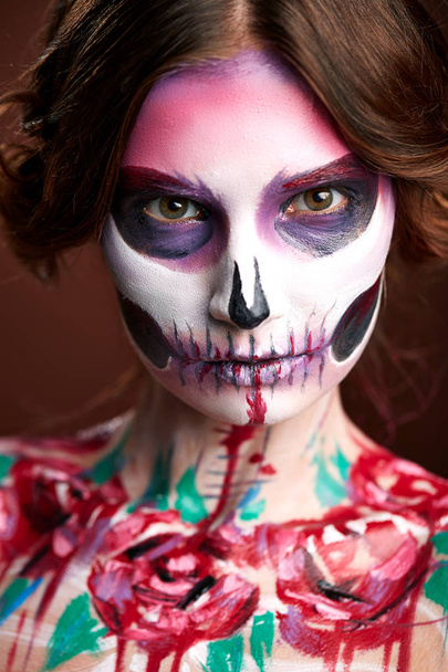 attractive young woman with sugar skull makeup Halloween  - Photo, Image