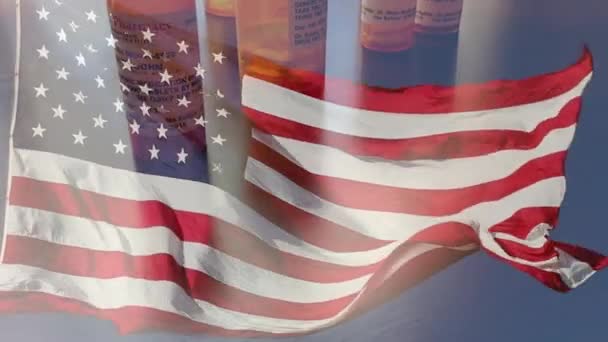 4k Slow Motion Medicine Bottles and Pills Falling With Ghosted American Flag Waving. The medicine bottle labels are non-proprietary with fictitious names, addresses and information designed specifically for the stock photography industry. - Filmmaterial, Video