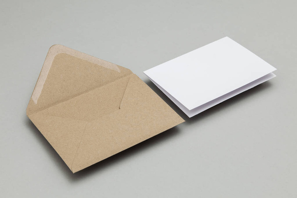 Blank white card with kraft brown paper envelope template mock u - Valokuva, kuva