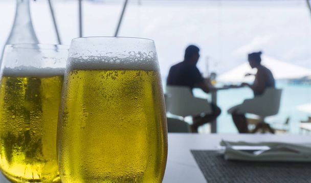 Glasses of larger in a restaurant  - Photo, Image