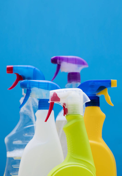Cleaning spray bottle products on a bright blue background - Photo, Image
