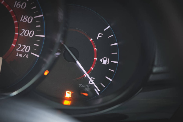 Low Fuel gauge showing fuel dashboard. - Foto, Bild
