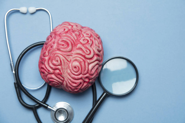 Mental health concept. human brain on a blue background - Фото, изображение
