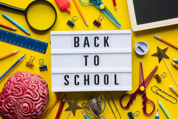 Back to school lightbox message on a bright yellow background - Foto, afbeelding