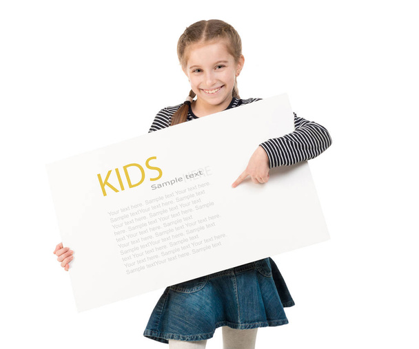 pretty schoolgirl with blank sheet in hands - Foto, Imagem