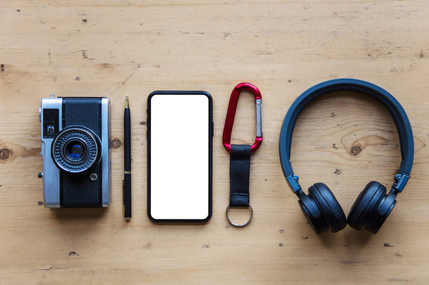 Modern smartphone with travel items. Blank screen phone display - Valokuva, kuva