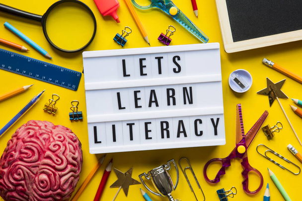 Lets learn literacy lightbox message on a bright yellow backgrou - Фото, зображення