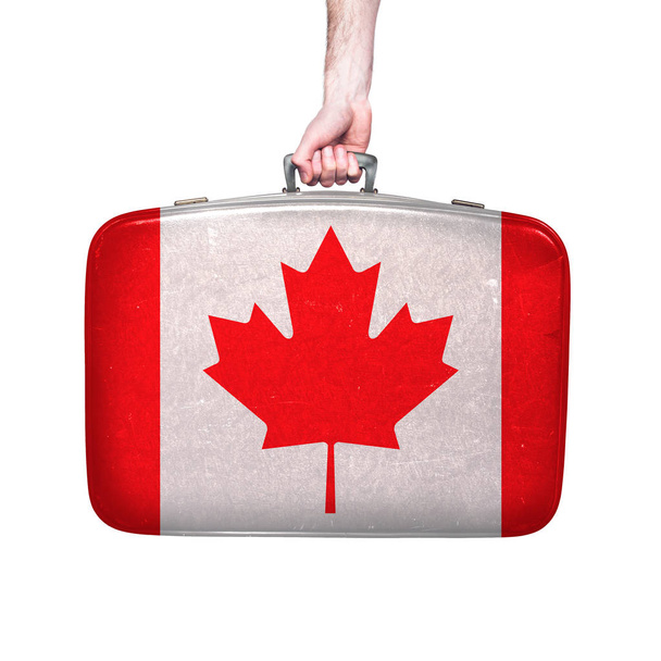 Canada flag on a vintage leather suitcase. - 写真・画像