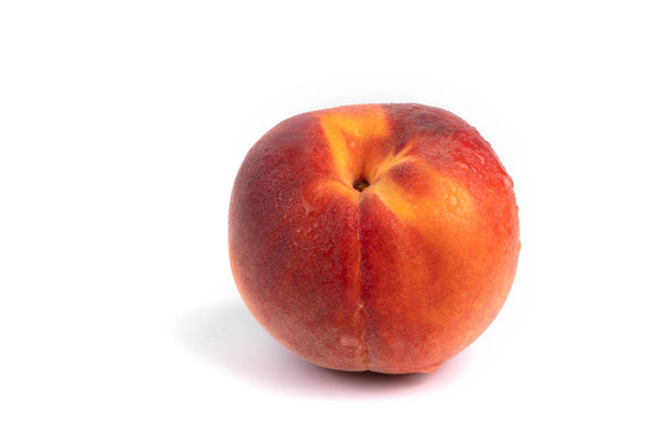 Side view on isolated colorful wet peach on white background - Photo, Image