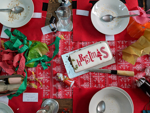 Christmas dinner after the party. Messy table. Overhead view. - Photo, Image