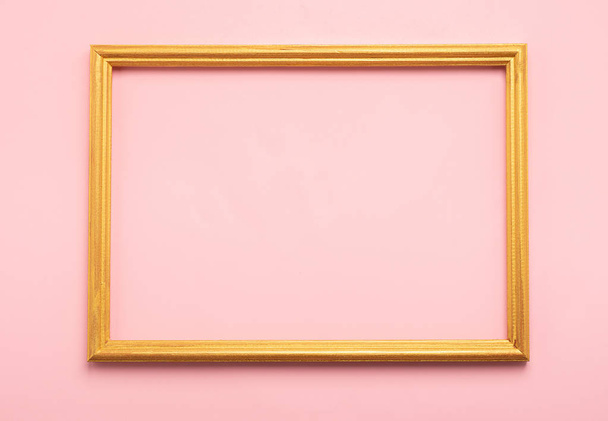 Golden square empty blank frame on pink background. Minimalism holiday concept. Flat lay. Copy space. - Photo, Image