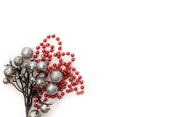 Christmas composition. Silver balls and red tinsel on a light ba - Foto, Imagem