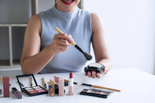 Elegant female Beauty blogger showing testing beauty cosmetic us - Zdjęcie, obraz
