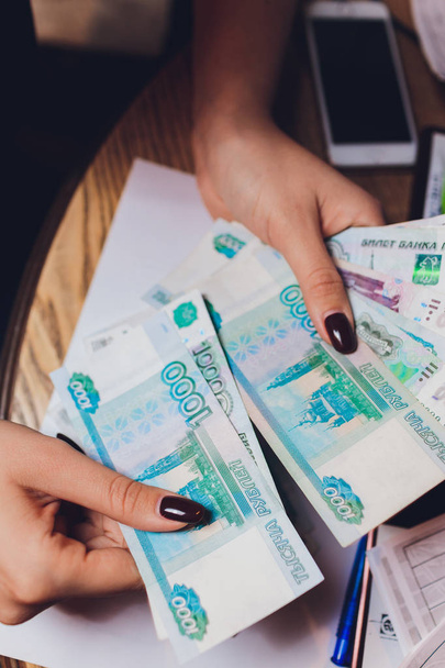 Russian rubles in the hands of a business woman. - Photo, Image