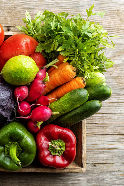 organic food background Vegetables in the basket, Fresh vegetables basket on a wooden table - Photo, Image