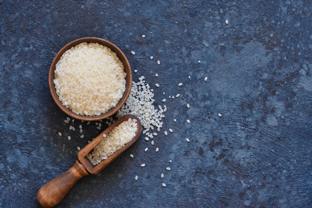 White rice on a concrete kitchen table. View from above. - Foto, imagen