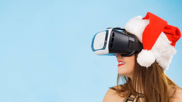 Girl watching 3d film tour in virtual reality glasses. - Фото, зображення