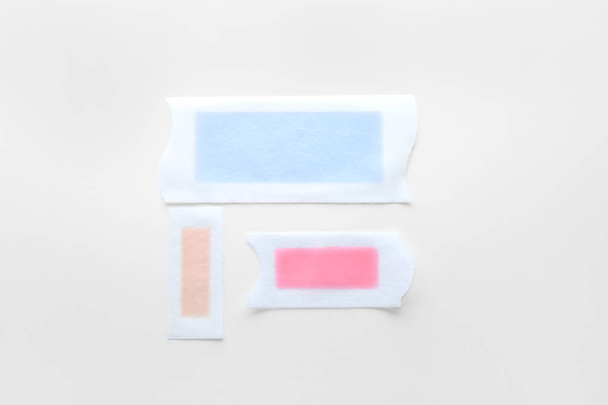 Wax strips for hair removal on white background - Fotó, kép