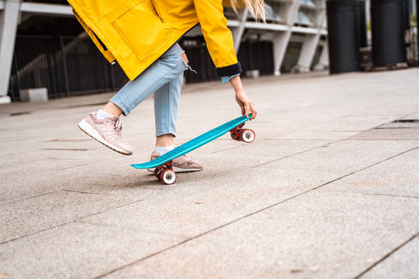 Teens ride a skateboard in the city. Youth culture - Фото, зображення