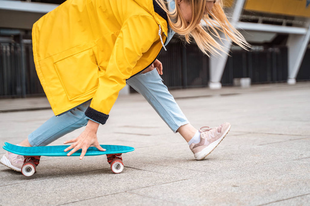 Teens ride a skateboard in the city. Youth culture - 写真・画像