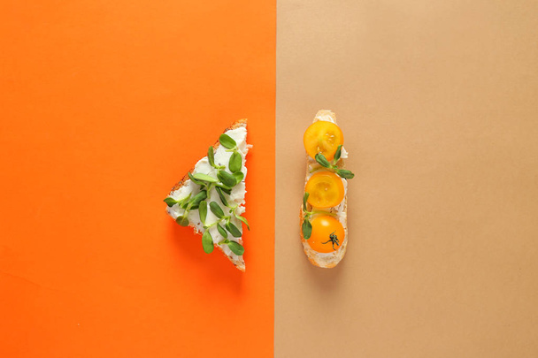 Different tasty sandwiches on color background - Fotografie, Obrázek