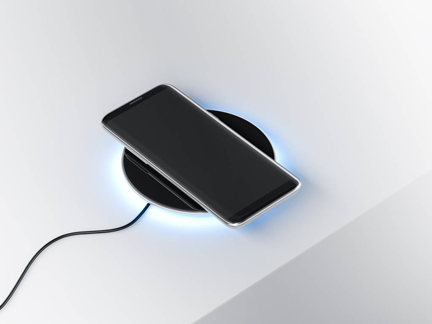Black Modern Smartphone mockup on the wireless charging device, 3d rendering - Fotografie, Obrázek