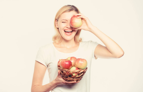 This should be fine. vitamin diet. Nature. autumn harvest. Spring seasonal fruit. orchard, girl with apple basket. farming green life. healthy food. Happy woman eat apple. Enjoying healthy lifestyle - Fotoğraf, Görsel